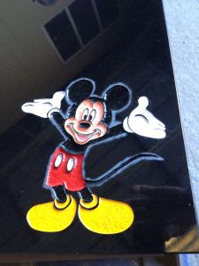 Coloured Mickey mouse engraving on a headstone