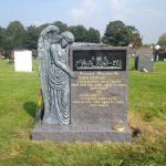 memorial with angel carving