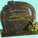 memorial with curved borders and two raised hearts