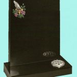 Polished black headstone with colourful etched bird