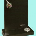 Polished black headstone with colourful etched bird