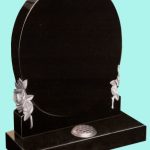 Black granite oval headstone with intricate rose detail