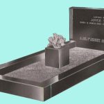 Dense black granite kerbed headstone