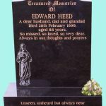Black Headstone with religious engraving